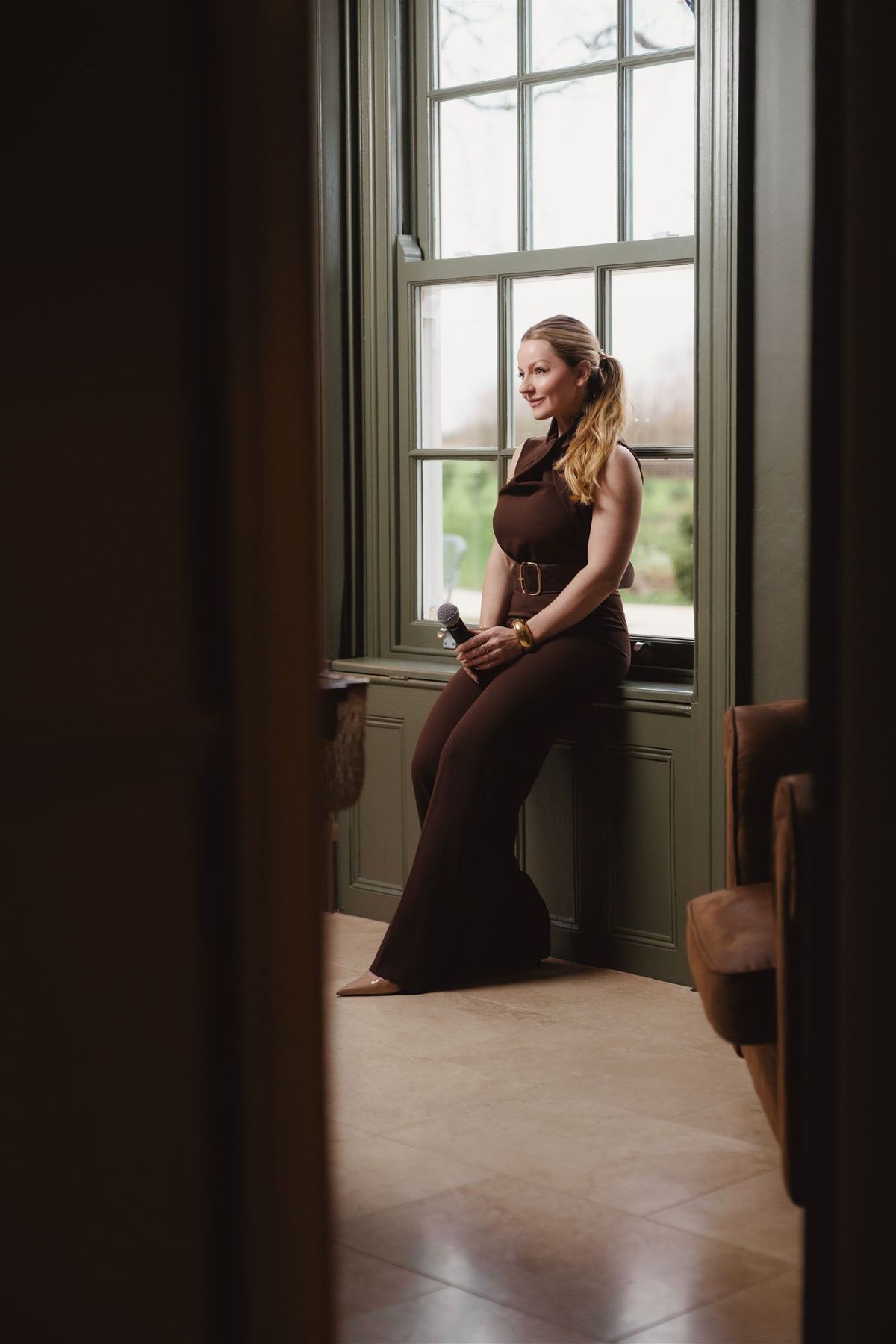 Abigail sitting by a window
