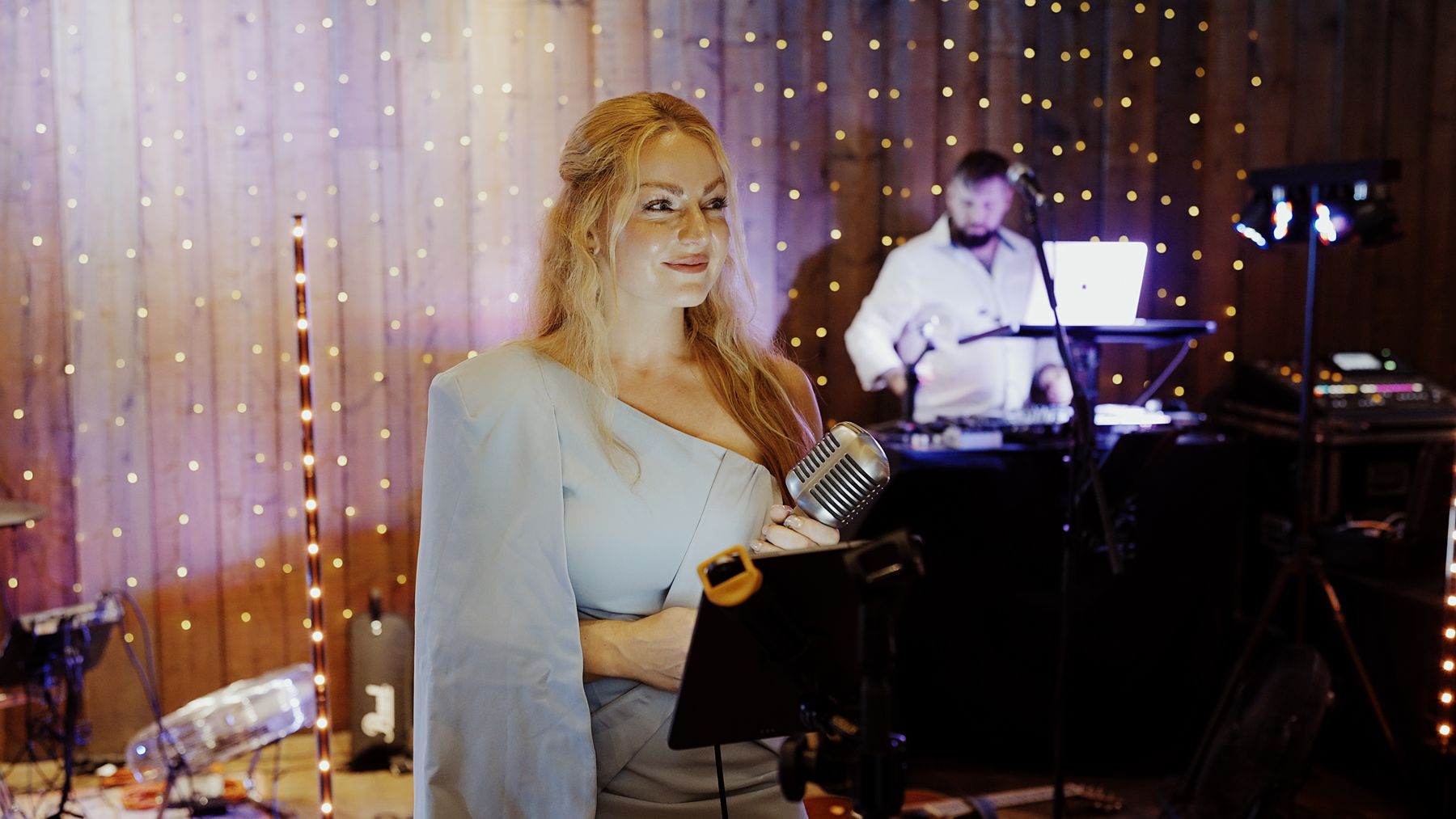 Abigail performing under fairy lights